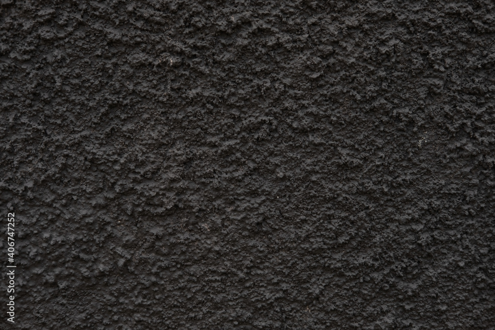 Fototapeta premium The texture of the black textured wall. Dark wall for background.
