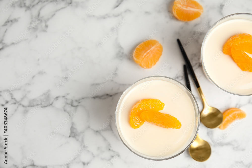 Delicious tangerine jelly on white marble table, flat lay. Space for text Delicious tangerine jelly on white marble table, flat lay. Space for text