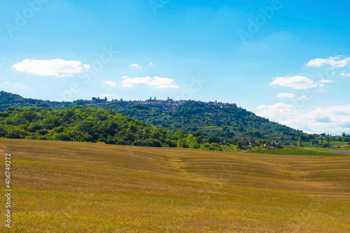 The late summer landscape around Montalcino in Siena Province, Tuscany, Italy. The town of Montalcino can be seen on the hill in the background  © dragoncello