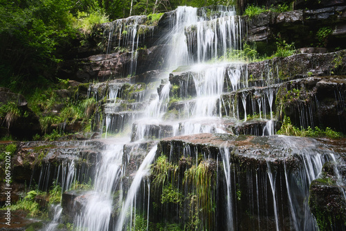 Fototapeta Naklejka Na Ścianę i Meble -  The fascinating Tupavica Waterfall is settled in a Dojkinci village at 1050 m above the sea level in the heart of Stara planina mountains, Serbia