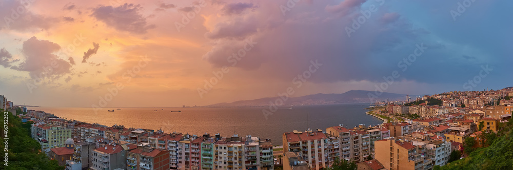 Panorama of the night city of Izmir, coastline and bay, photo from elevator tower