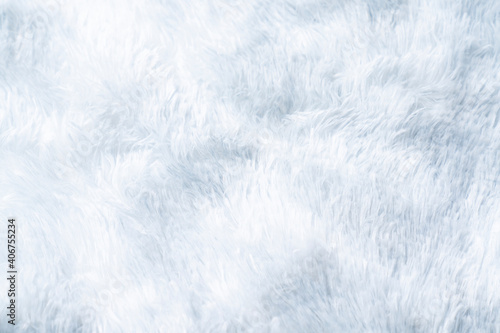 Close up white shaggy artificial fur texture or carpet for background.