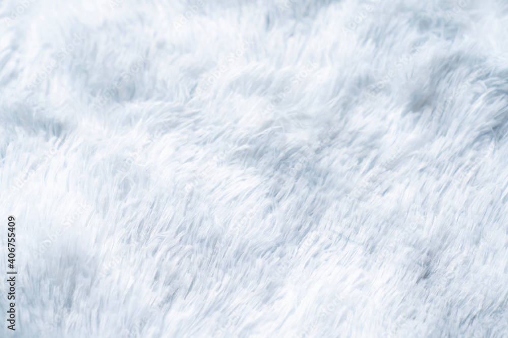 Close up white shaggy artificial fur texture or carpet for background.