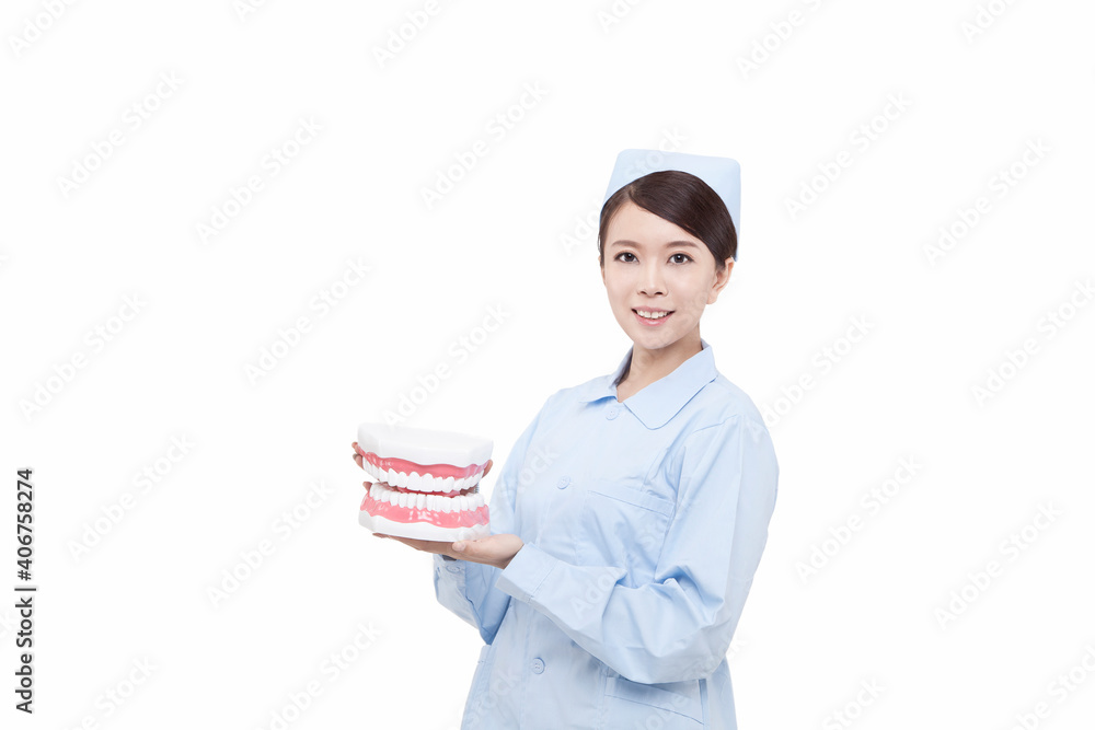 Portrait of young female dentist holding dental east Portrait of young female dentist holding dental east