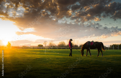  young girl with horse at the sunset