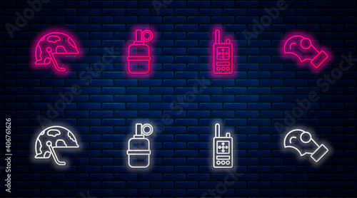 Set line Hand grenade, Walkie talkie, Military helmet and Gas mask. Glowing neon icon on brick wall. Vector.