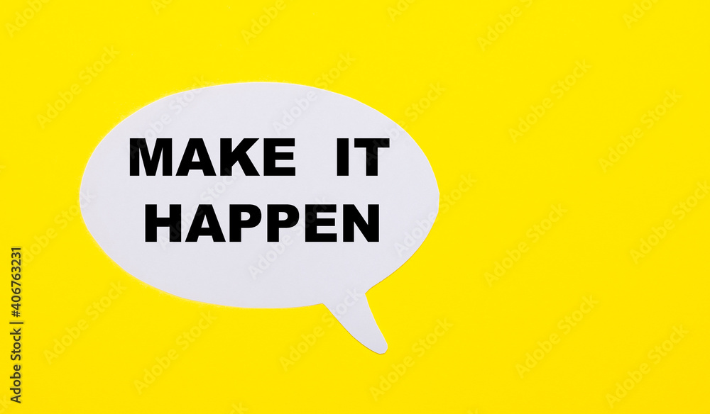 On a bright yellow background, white paper with the words MAKE IT HAPPEN On a bright yellow background, white paper with the words MAKE IT HAPPEN