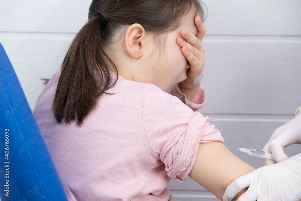 the child is afraid when they want to be vaccinated in his arm the child is afraid when they want to be vaccinated in his arm