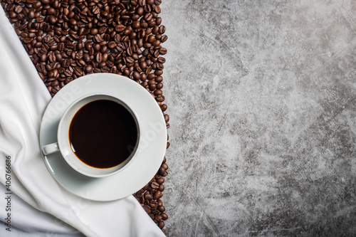 Background Coffee cup and beans on old kitchen table. Top view with copyspace for your text