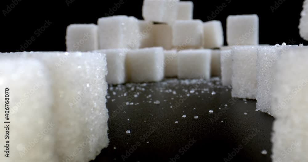 View of pyramids from sugar cubes. Concept of sugar substitute. Refuse sugar. Close up. High quality. View of pyramids from sugar cubes. Concept of sugar substitute. Refuse sugar. Close up. High quality.