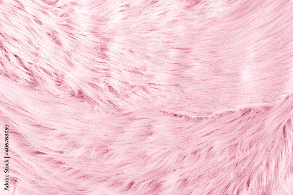 Fototapeta premium Light pink long fiber soft fur. Pink fur for background or texture. Fuzzy pink fur plaid. Shaggy blanket background. Fluffy fake textile fur. Flat lay, top view, copy space