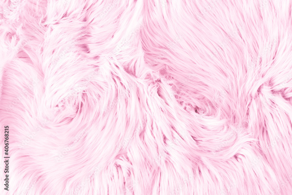 Light pink long fiber soft fur. Pink fur for background or texture. Fuzzy pink fur plaid. Shaggy blanket background. Fluffy fake textile fur. Flat lay, top view, copy space