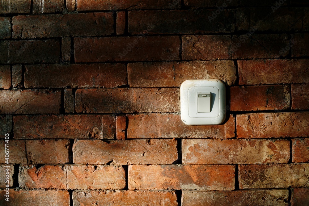 electrical outlet on a wall. switch light on the brick wall Stock Photo