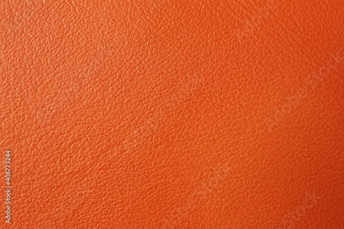 Texture of orange leather as background, closeup © New Africa