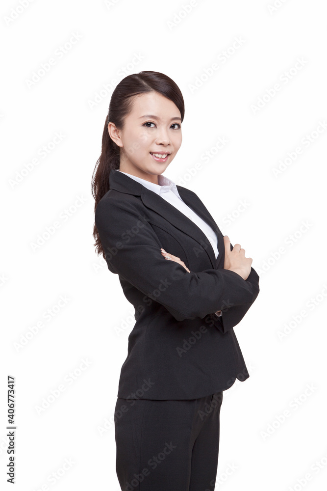 Portrait of young businesswoman standing folding arms Portrait of young businesswoman standing folding arms