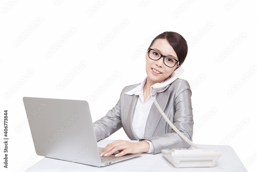 Portrait of young businesswoman talking on telephone at desk Portrait of young businesswoman talking on telephone at desk