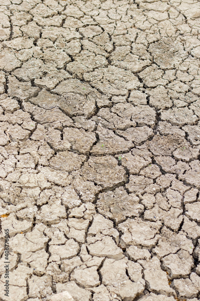 Cracked soil due to no rainfall and dry climate or drought. Cracked soil due to no rainfall and dry climate or drought.