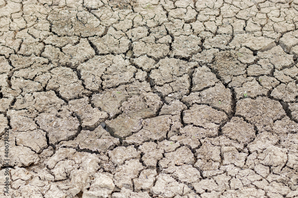 Cracked soil due to no rainfall and dry climate or drought. Cracked soil due to no rainfall and dry climate or drought.