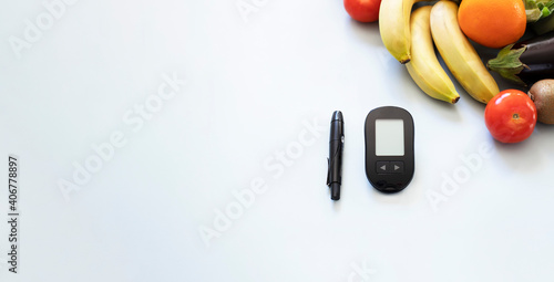 Glucose meter, lancelet and low glycemic healthy foods for diabetic diet. Web banner photo