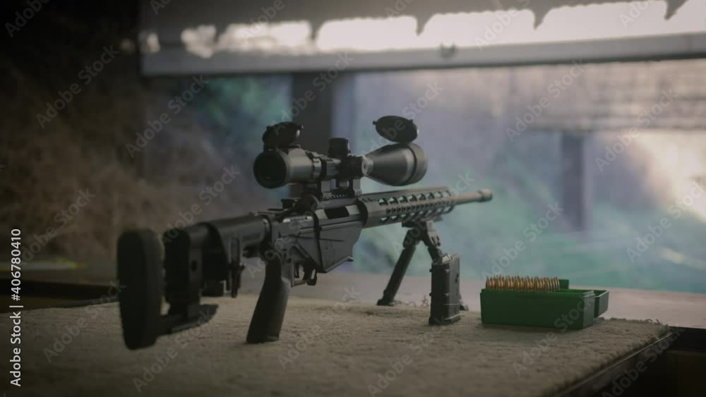 Precision rifle with scope magazine and ammo box ready for shooting ...