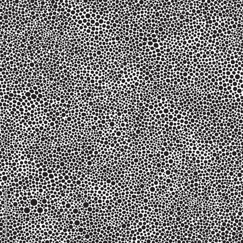 Vector seamless abstract pattern from black round spots on a white background. Animal print, wallpaper, batik paint, wrapping paper, Fashionable grunge textile print