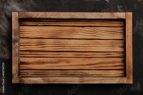 Handmade wooden rustic items on a plastered textured table for background. Space fo text