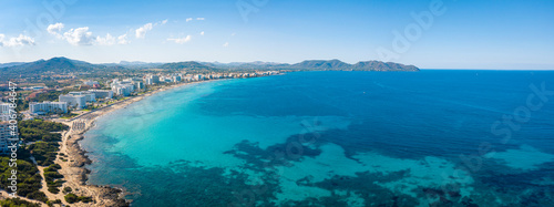 An aerial panorama on Cala Millor beach on Mallorca island in Spain at evening time