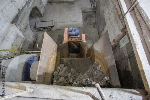 Ore crusher machine at the underground gold mine tunnel