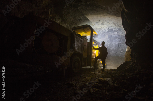 Drilling machine Sandvik in underground gold mine tunnel photo
