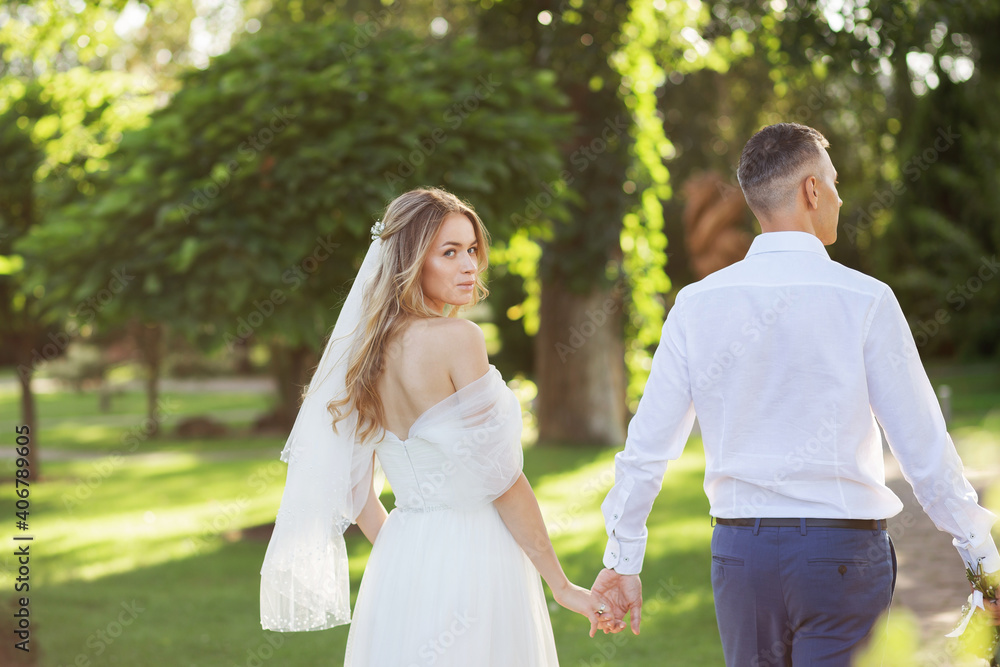 Amazing smiling wedding couple. Pretty bride and stylish groom. Amazing smiling wedding couple. Pretty bride and stylish groom.