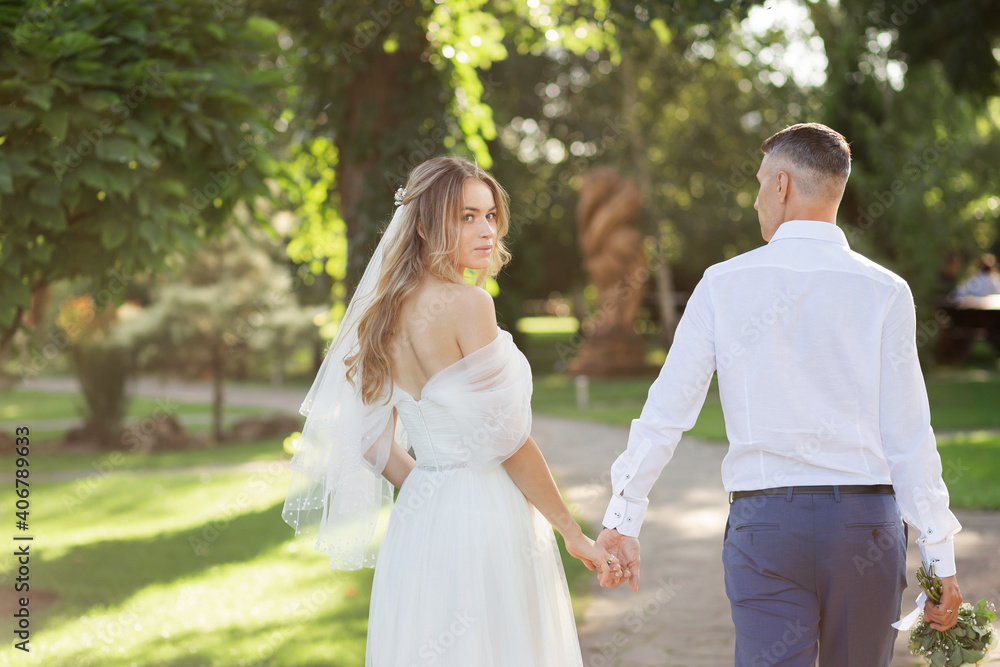 Amazing smiling wedding couple. Pretty bride and stylish groom. Amazing smiling wedding couple. Pretty bride and stylish groom.