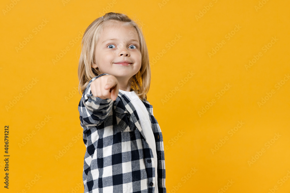 Little cute fun happy blond long-haired kid boy 5 years old wearing casual clothes posing isolated on bright yellow wall color background children studio portrait. People childhood lifestyle concept Little cute fun happy blond long-haired kid boy 5 years old wearing casual clothes posing isolated on bright yellow wall color background children studio portrait. People childhood lifestyle concept