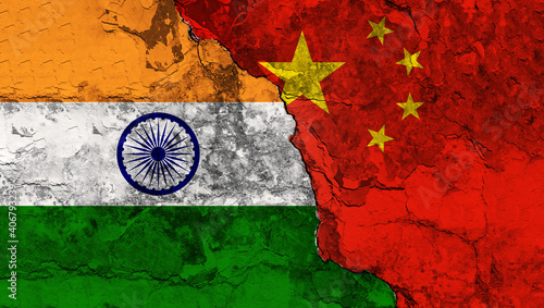 Concept of the conflictual Relations between India and China by Flags on a Wall with a Crack