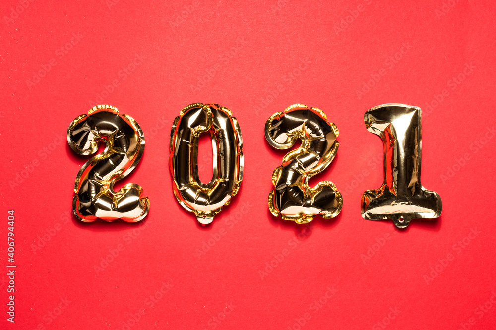 Gold Christmas balloons 2021 on a red background. Chinese New Year numbers. Flat lay and top view, template for copy space Gold Christmas balloons 2021 on a red background. Chinese New Year numbers. Flat lay and top view, template for copy space