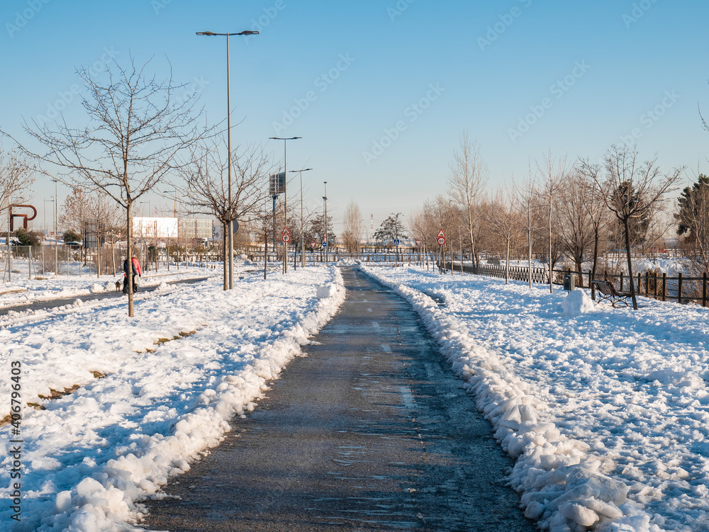 Roads opened through the snow for the transit of vehicles after the passage of the storm Filomena in the streets of the city Roads opened through the snow for the transit of vehicles after the passage of the storm Filomena in the streets of the city