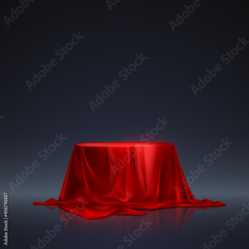 Red silk podium on dark background