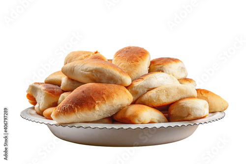 Fresh pies on a white plate and on a white isolated background.