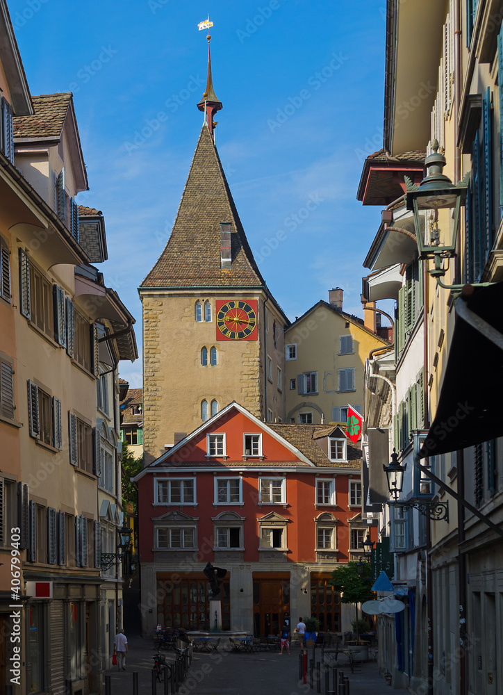 Obraz premium Tower with a red clock on Neumarkt Street in the Rathaus quarter of Zurich, Switzerland