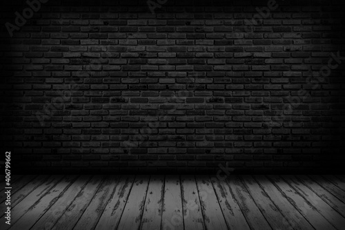 Black brick walls that are not plastered background and wooden floor. Hardwood floor texture of empty brick basement wall.