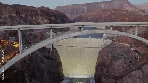 Rising aerial flies over Hoover dam structure bridge colorado river
