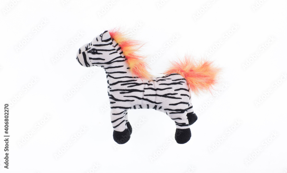 Fototapeta premium toy plush zebra on a white background