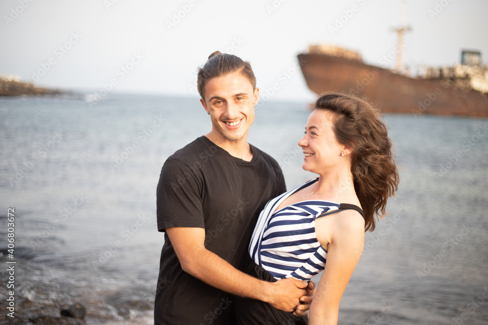 Beautiful couple in love smiles during their engagement vacation