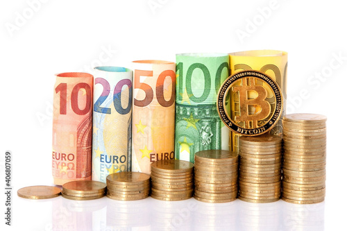 Bitcoin and Ten, twenty, fifty, one hundred, two hundred and coins euro rolled bills banknotes on white background. Histogram from the euro. Concept of currency growth, savings.