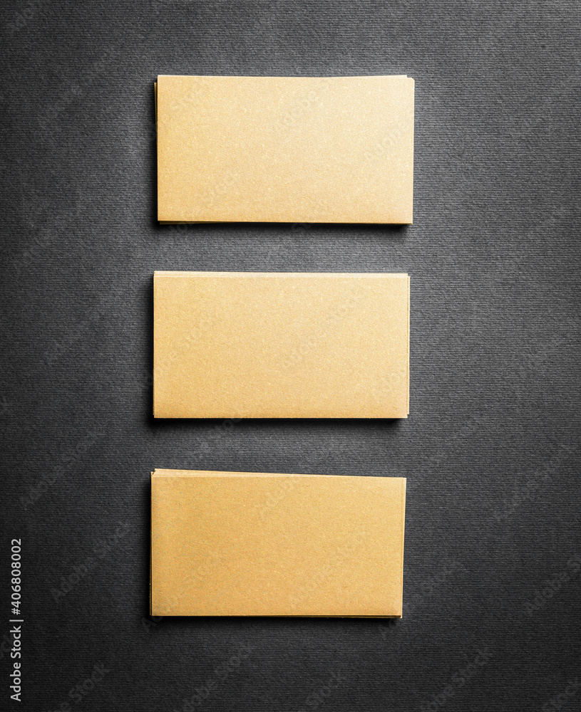 Fototapeta premium Blank golden business card on grey background