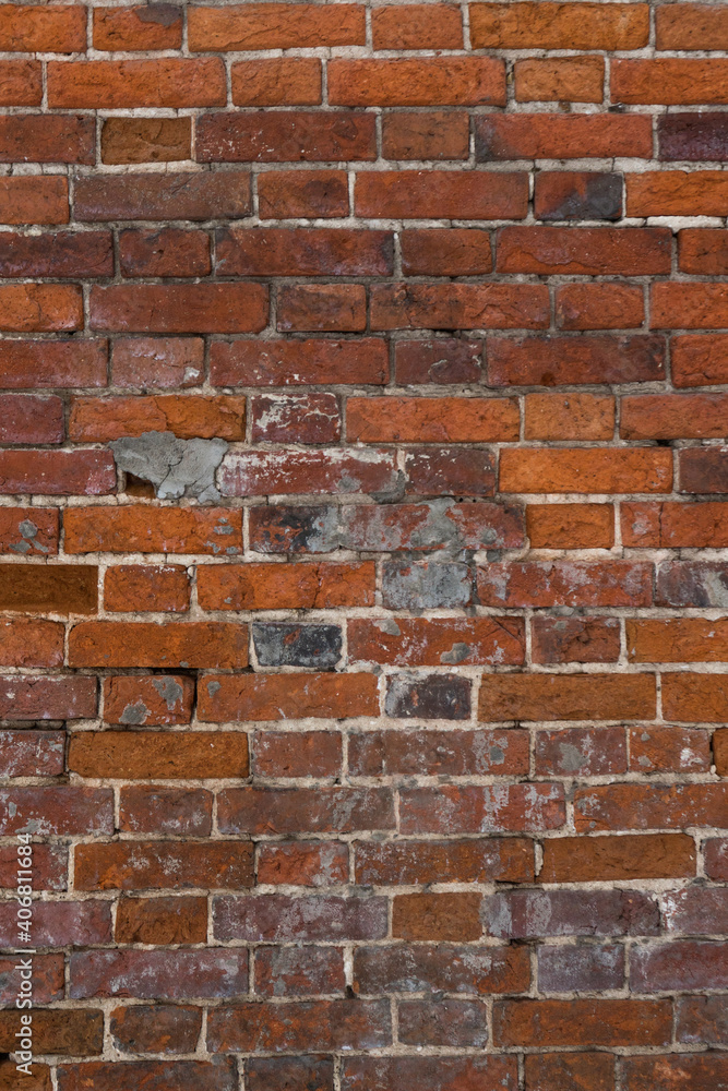 Fototapeta premium brick red wall. background of a old brick house.
