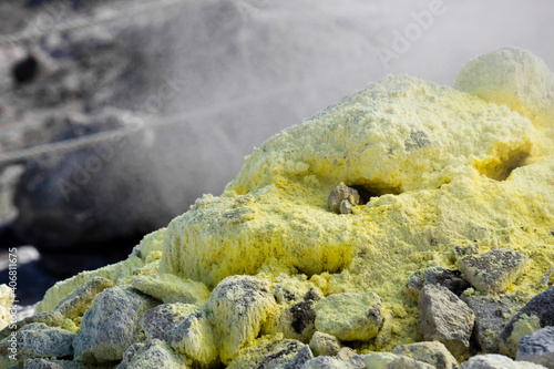 Fotografie Close up photo of a rocky area where sulfur crystallized