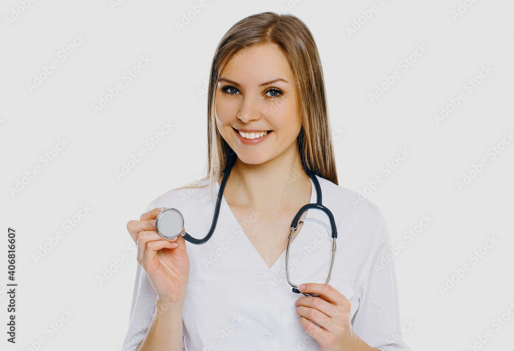 Portrait of friendly smiling woman doctor with stethoscope on a white background Portrait of friendly smiling woman doctor with stethoscope on a white background