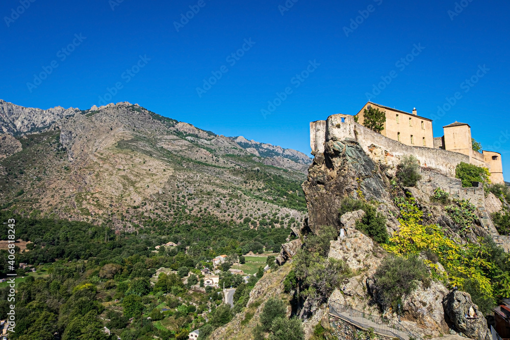 The mountains Punta di Zurmulu, Capo Nero, Punta Finosa, Capizzolo and the citadel of Corte, Corsica, France.
