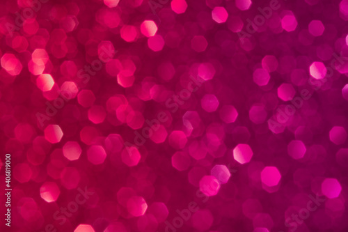 Abstract red and pink glitter lights background. Circle blurred bokeh. Romantic backdrop for Valentines day, womens day, holiday or event