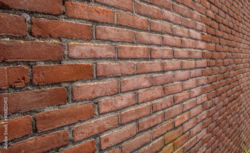 Close up of brick wall in summer sunshine